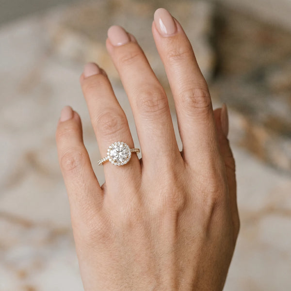 Yellow gold Round Diamond Halo Ring with Pavé Band and Four-Prong Setting