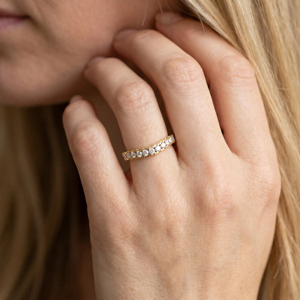 Yellow gold Round Diamond Pavé Curved Band with Shared Prong Setting
