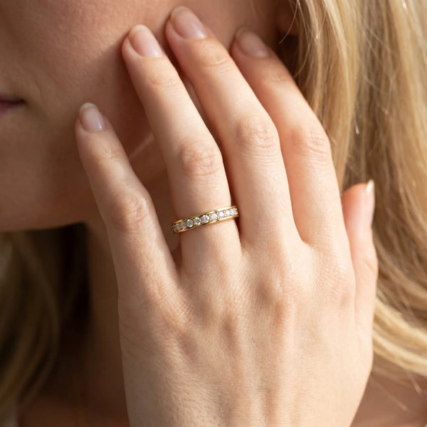 Yellow gold Round Diamond Pavé Set Eternity Band with Channel Setting