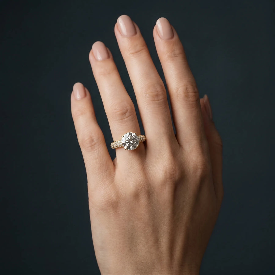 Yellow gold Round Diamond Solitaire Ring with Prong Setting and Pavé Band