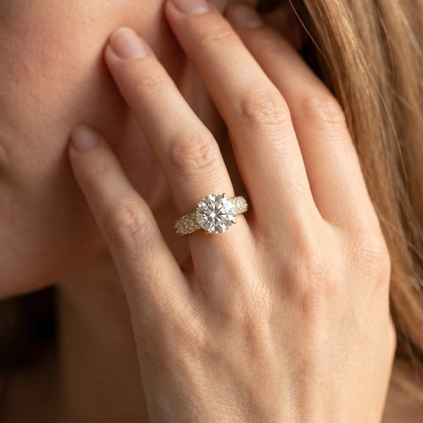 Yellow gold Round Diamond Solitaire Ring with Prong Setting and Pavé Band