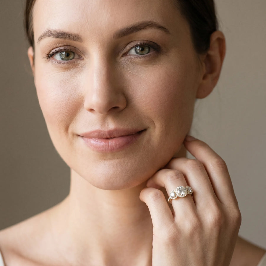 Yellow gold Round Diamond Three-Stone Halo Ring with Prong Setting and Pavé Band