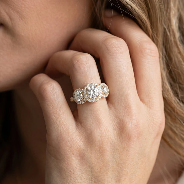 Yellow gold Round Diamond Three-Stone Halo Ring with Prong Setting and Pavé Band