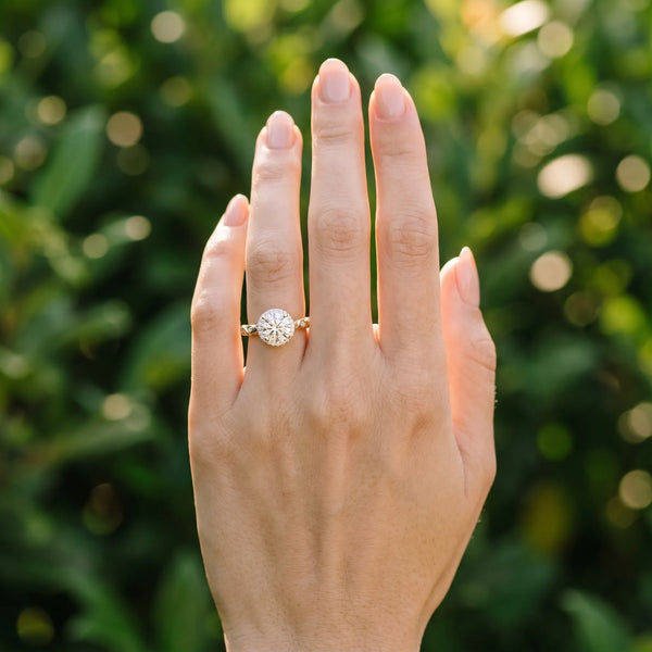 Yellow gold Round Halo Diamond Solitaire with Filigree Band and Four-Prong Setting