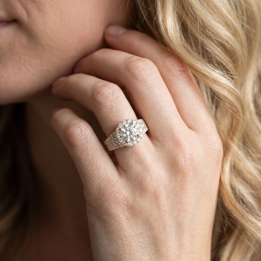 Yellow gold Round Halo Pavé Diamond Engagement Ring with Split Shank and Four-Prong Setting
