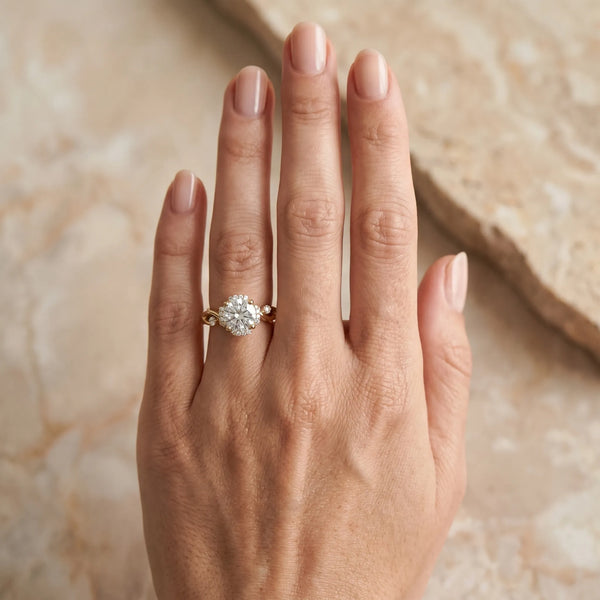 Yellow gold Round Halo Solitaire Diamond Ring with Twisted Band and Four-Prong Setting