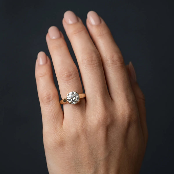Yellow gold Round Solitaire Diamond Engagement Ring with Four-Prong Setting and Tapered Band