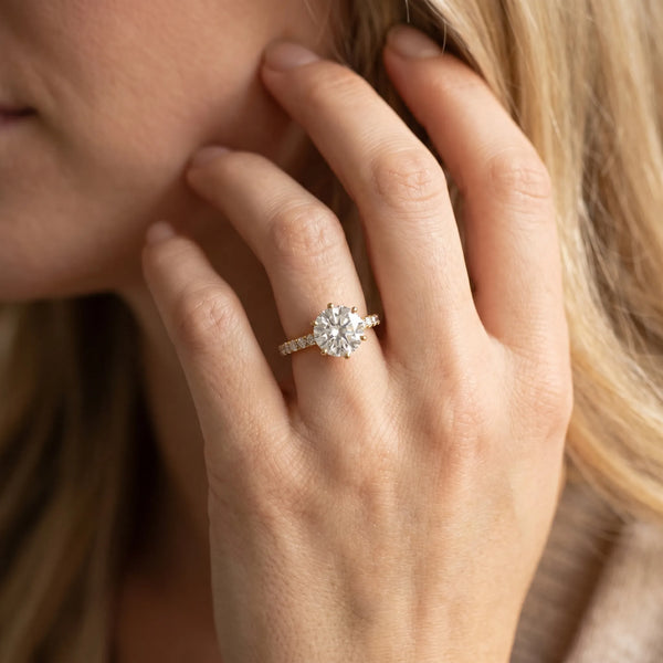 Yellow gold Round Solitaire Diamond Engagement Ring with Pavé Band and Six-Prong Setting