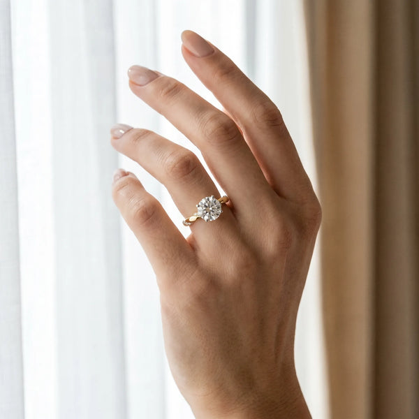 Yellow gold Round Solitaire Diamond Engagement Ring with Twisted Pave Band and Four-Prong Setting