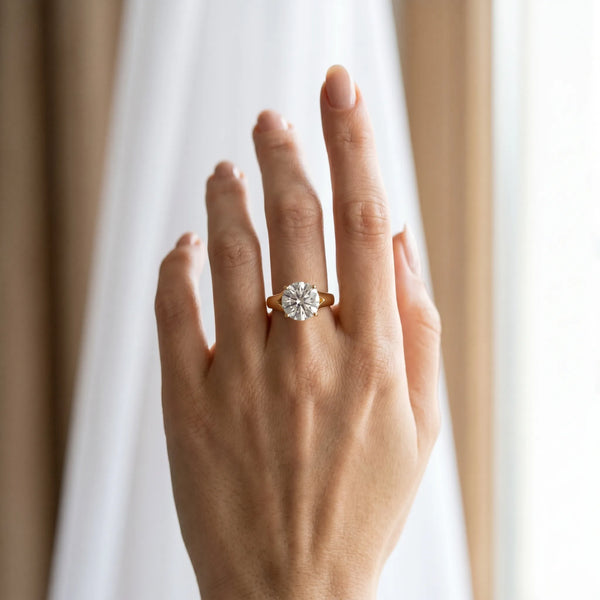 Yellow gold Round Solitaire Diamond Ring with Cathedral Band and Four-Prong Setting