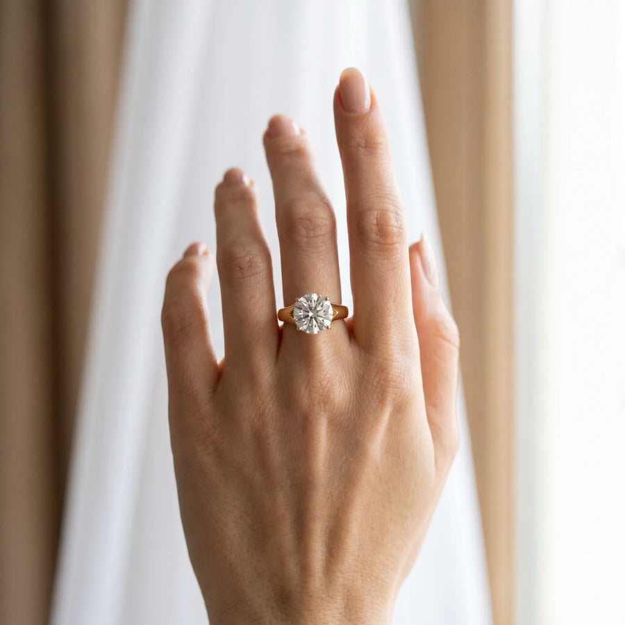 Yellow gold Round Solitaire Diamond Ring with Cathedral Band and Four-Prong Setting