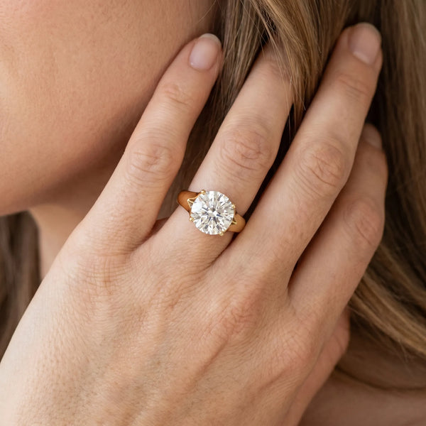 Yellow gold Round Solitaire Diamond Ring with Cathedral Band and Four-Prong Setting