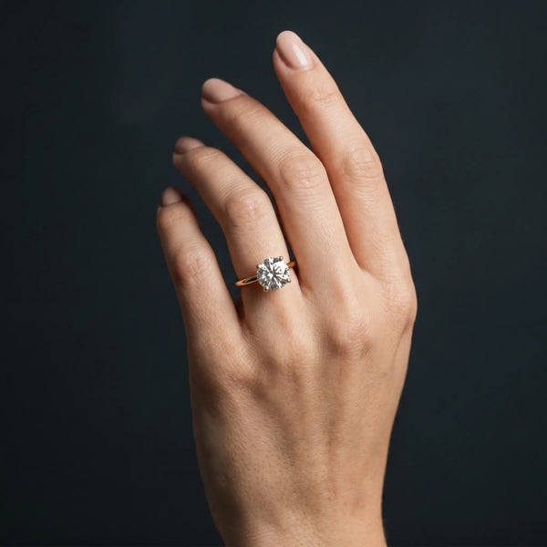 Yellow gold Round Solitaire Diamond Ring with Prong Setting and Plain Band