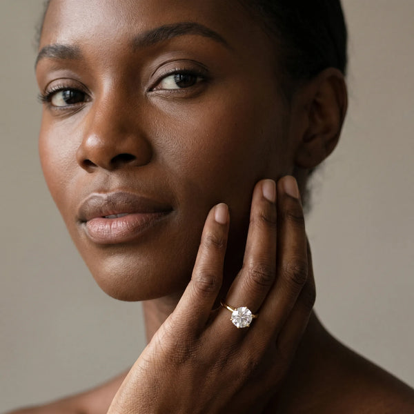 Yellow gold Round Solitaire Diamond Ring with Six-Prong Setting on a Classic Band
