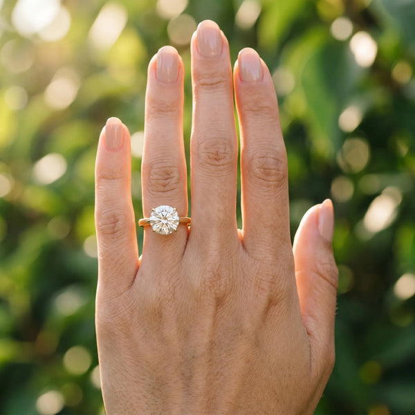 Yellow gold Round Solitaire Diamond Ring with Split Shank and Four-Prong Setting