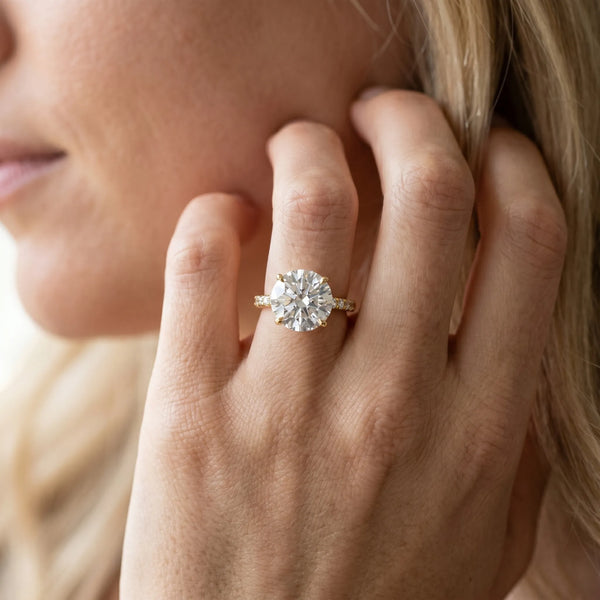 Yellow gold Round Solitaire Diamond Ring with Split Shank and Four-Prong Setting