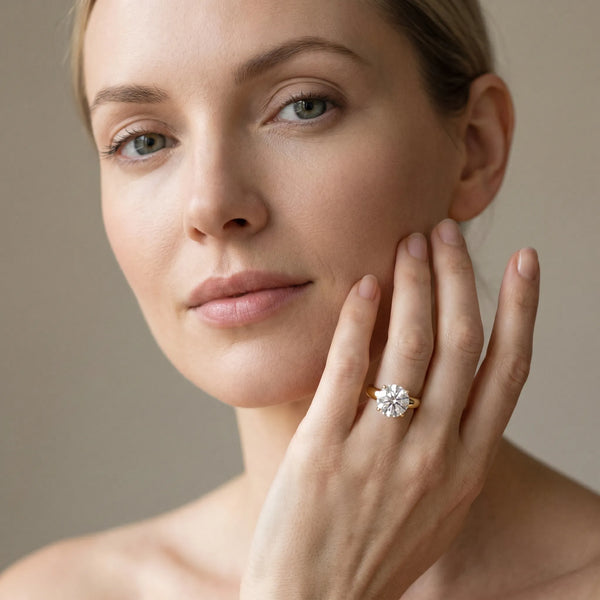 Yellow gold Round Solitaire Diamond Ring with Tapered Band and Four-Prong Setting