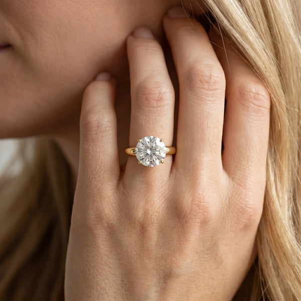 Yellow gold Round Solitaire Diamond Ring with Tapered Band and Four-Prong Setting