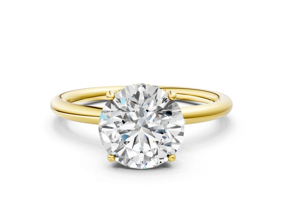Yellow gold Round Solitaire Diamond Ring with a Classic Band and Four-Prong Setting