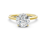 Yellow gold Round Solitaire Diamond Ring with a Classic Band and Four-Prong Setting