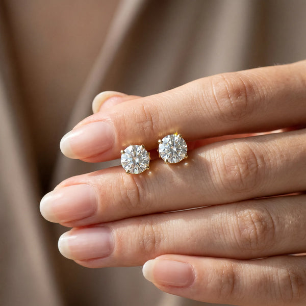 Yellow gold Round Solitaire Diamond Stud Earrings with Four-Prong Basket Setting