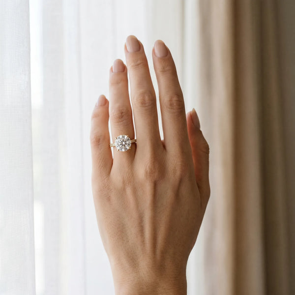 Yellow gold Round Solitaire Engagement Ring with Four-Prong Setting and Classic Band