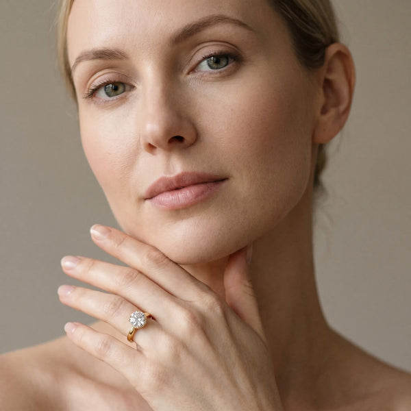 Yellow gold Round Solitaire Engagement Ring with Four-Prong Setting and Tapered Band