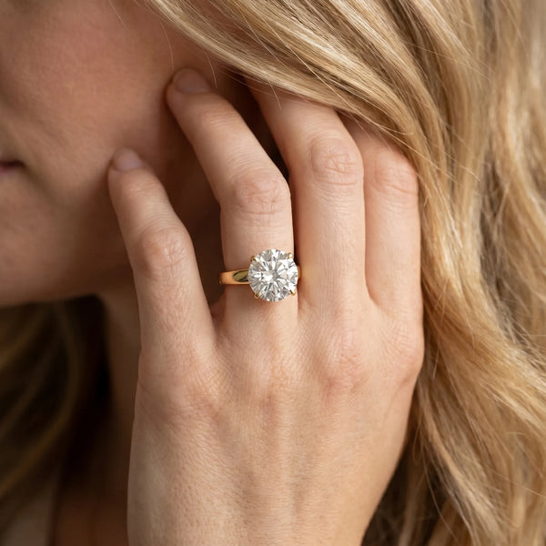 Yellow gold Round Solitaire Engagement Ring with Four-Prong Setting and Tapered Band