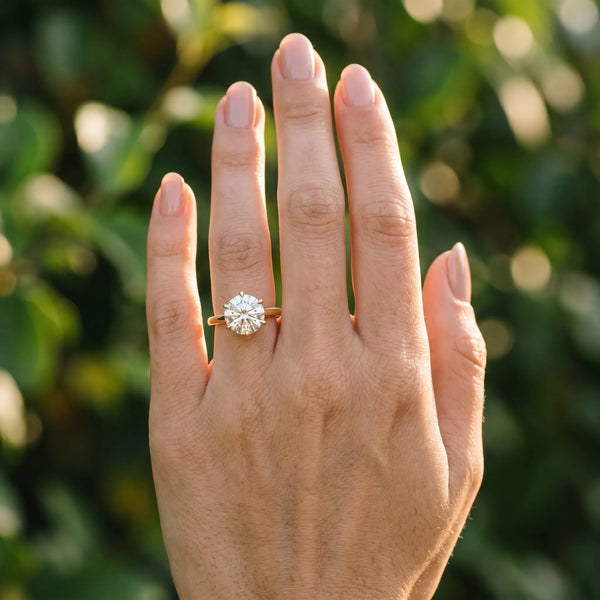 Yellow gold Round Solitaire Engagement Ring with Six-Prong Setting and Classic Band