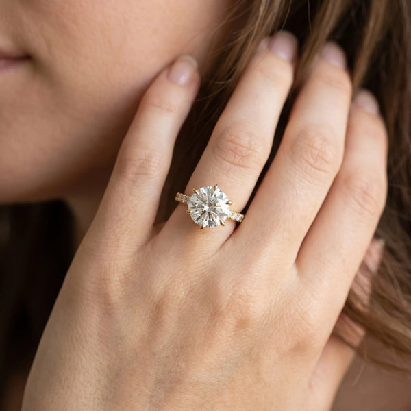 Yellow gold Round Solitaire Engagement Ring with Six-Prong Setting and Classic Band