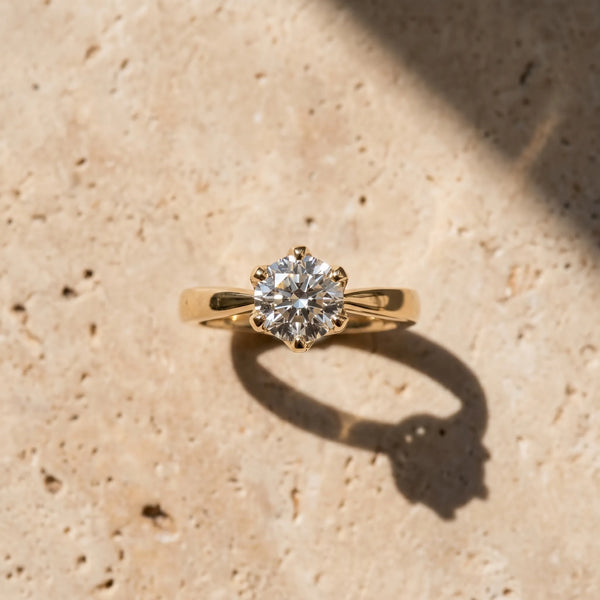 Yellow gold Round Solitaire Engagement Ring with Six-Prong Setting and Tapered Band