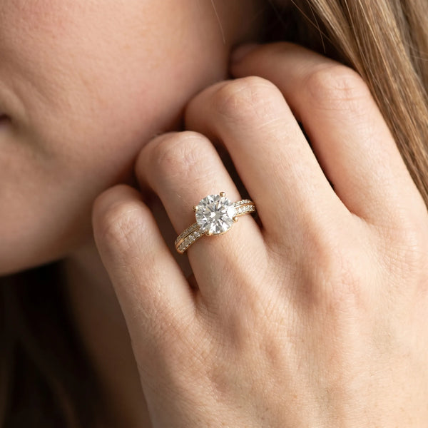 Yellow gold Round Solitaire Split Shank Pave Diamond Engagement Ring with Four-Prong Setting