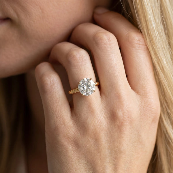 Yellow gold Round Solitaire Twist Band Ring with Four-Prong Setting