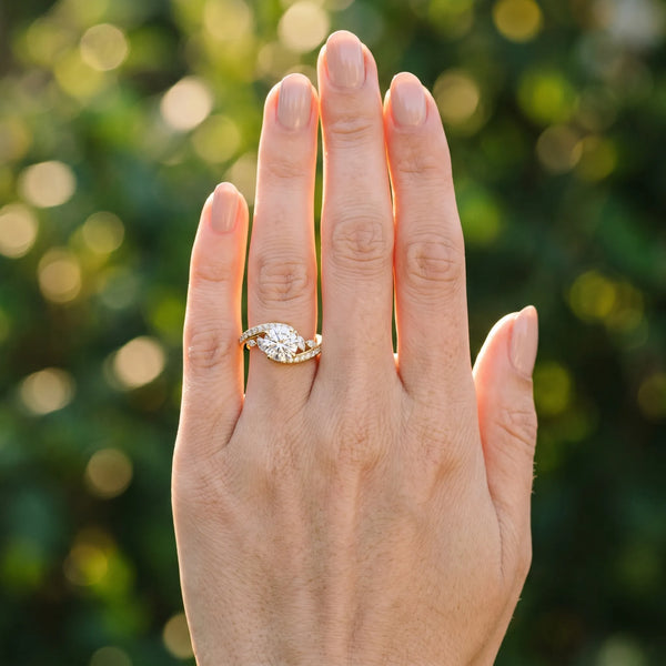 Yellow gold Round Solitaire with Pavé Twist Band and Four-Prong Setting