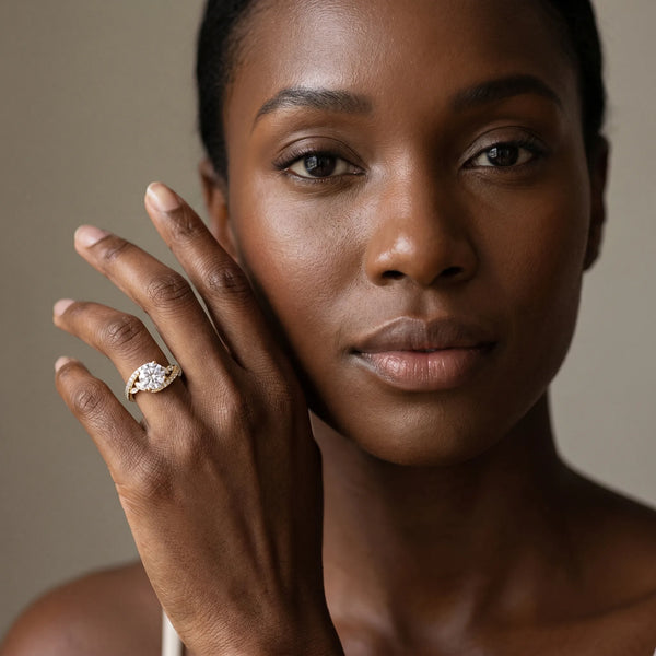 Yellow gold Round Solitaire with Pavé Twist Band and Four-Prong Setting