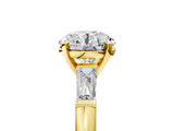 Yellow gold Round Solitaire with Tapered Baguette Side Stones on a Classic Band with Four-Prong Setting_138