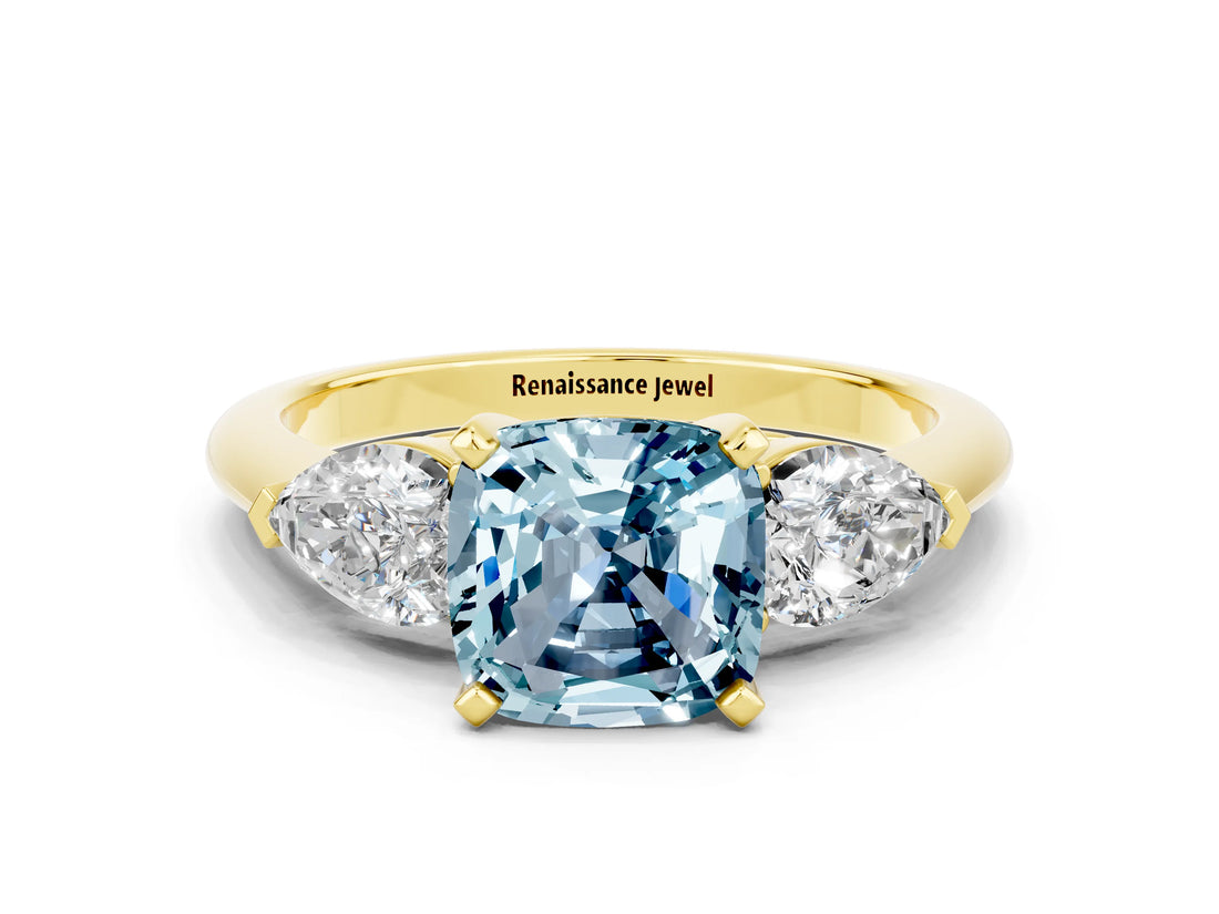 Yellow gold Three-Stone Cushion Cut Aquamarine Ring with Pear Side Stones and Four-Prong Setting