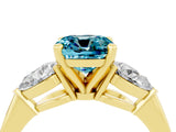 Yellow gold Three-Stone Cushion Cut Blue Topaz Ring with Pear Side Stones and Four-Prong Setting_4
