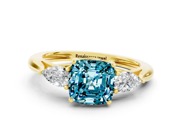 Yellow gold Three-Stone Cushion Cut Blue Topaz Ring with Pear  Side Stones in Four-Prong Setting