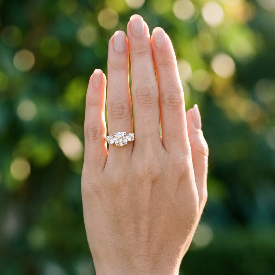 Yellow gold Three-Stone Cushion Cut Diamond Engagement Ring with Prong Setting on a White Gold Band