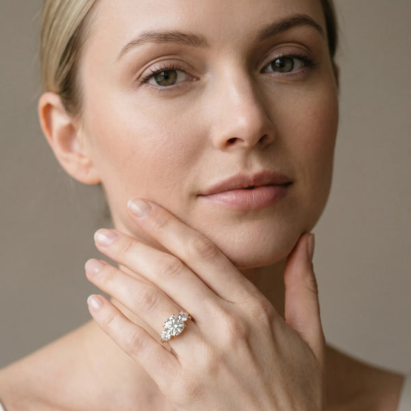 Yellow gold Three-Stone Cushion Cut Diamond Engagement Ring with Prong Setting on a White Gold Band