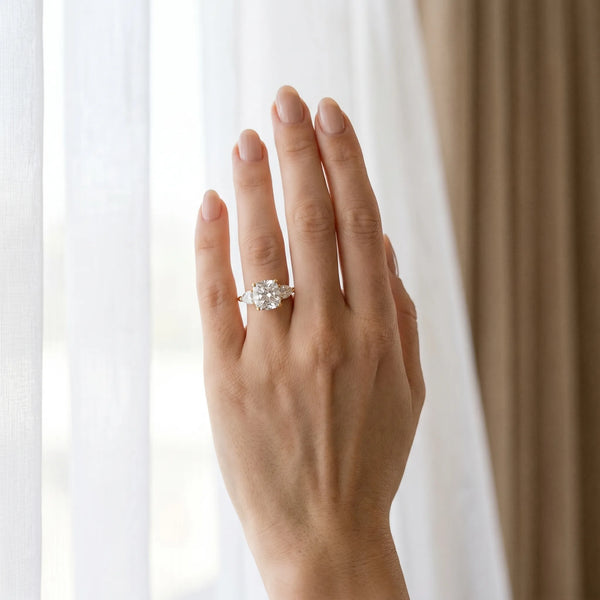 Yellow gold Three-Stone Cushion Cut Diamond Ring with Pear Side Stones and Four-Prong Setting