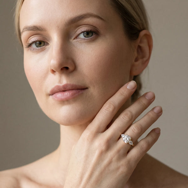 Yellow gold Three-Stone Cushion Cut Diamond Ring with Pear Side Stones and Four-Prong Setting