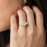 Yellow gold Three-Stone Cushion Cut Diamond Ring with Round Accent Stones, Prong Setting, and Classic Band_5