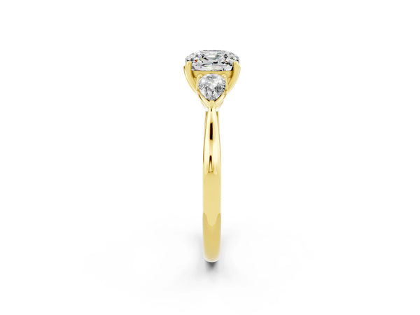 Yellow gold Three-Stone Cushion Cut Moissanite Ring with Pear  Side Stones in Four-Prong Setting