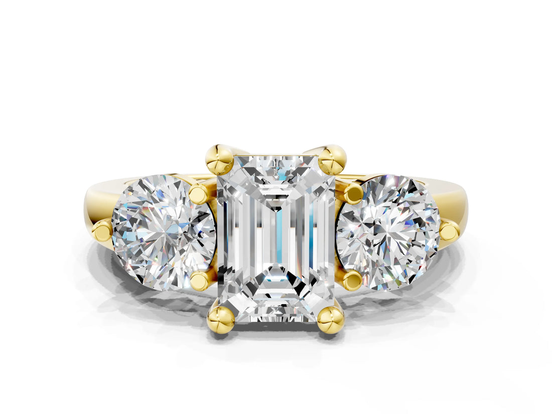 Yellow gold Three-Stone Emerald Brilliant Cut Solitaire Ring with Prong Setting on a Classic Band