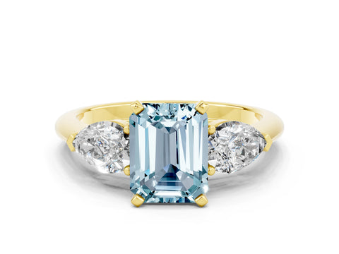 Yellow gold Three-Stone Emerald Cut Aquamarine Ring with Pear Side Stones and Four-Prong Setting