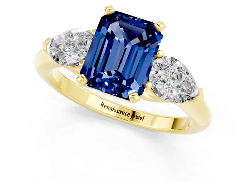 Yellow gold Three-Stone Emerald Cut Blue Sapphire Ring with Pear Side Stones and Four-Prong Setting_1