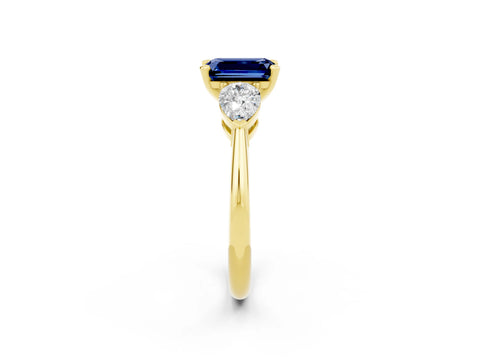 Yellow gold Three-Stone Emerald Cut Blue Sapphire Ring with Pear Side Stones and Four-Prong Setting_2
