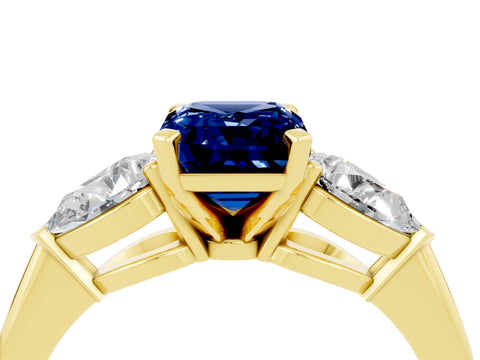 Yellow gold Three-Stone Emerald Cut Blue Sapphire Ring with Pear Side Stones and Four-Prong Setting_4